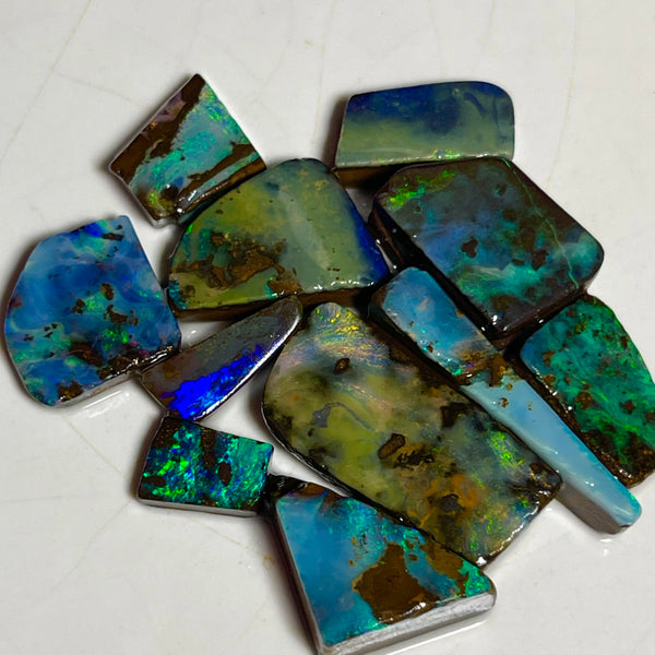 Winton Boulder opal Rubs/rough/preforms parcel 76.50cts Nice faces mostly greens/blues/Yellows 23x10x3 to 9x5x2mm NEW939