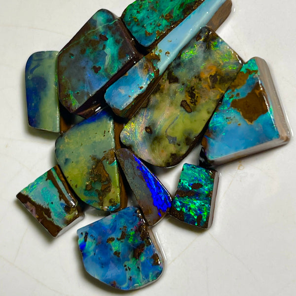 Winton Boulder opal Rubs/rough/preforms parcel 76.50cts Nice faces mostly greens/blues/Yellows 23x10x3 to 9x5x2mm NEW939