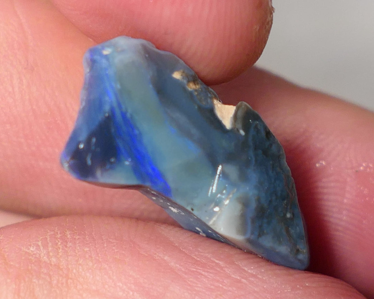 Lightning Ridge Rough Opal 10cts Dark Base Gamble Seam Blues in the bar 24x10x9mm 0621