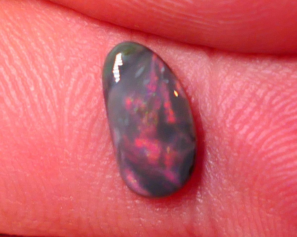 Lightning Ridge Red on Dark base Opal Gemstone 0.7cts Red dominant fires with Flat face 10x5x2mm 0652