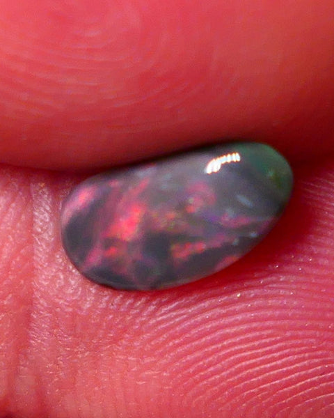 Lightning Ridge Red on Dark base Opal Gemstone 0.7cts Red dominant fires with Flat face 10x5x2mm 0652