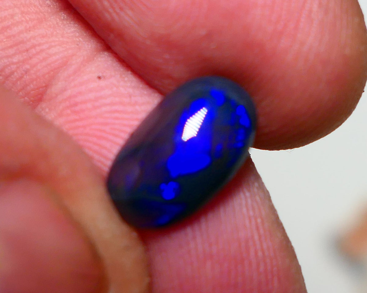 Lightning Ridge Semi Black Crystal Opal High Dome Gemstone 2.00cts GEM Grade N5 Body Tone B3 Brightness  Rolling Flash Royal Blues in various patterns 12.2x7.3x3.8mm 1327