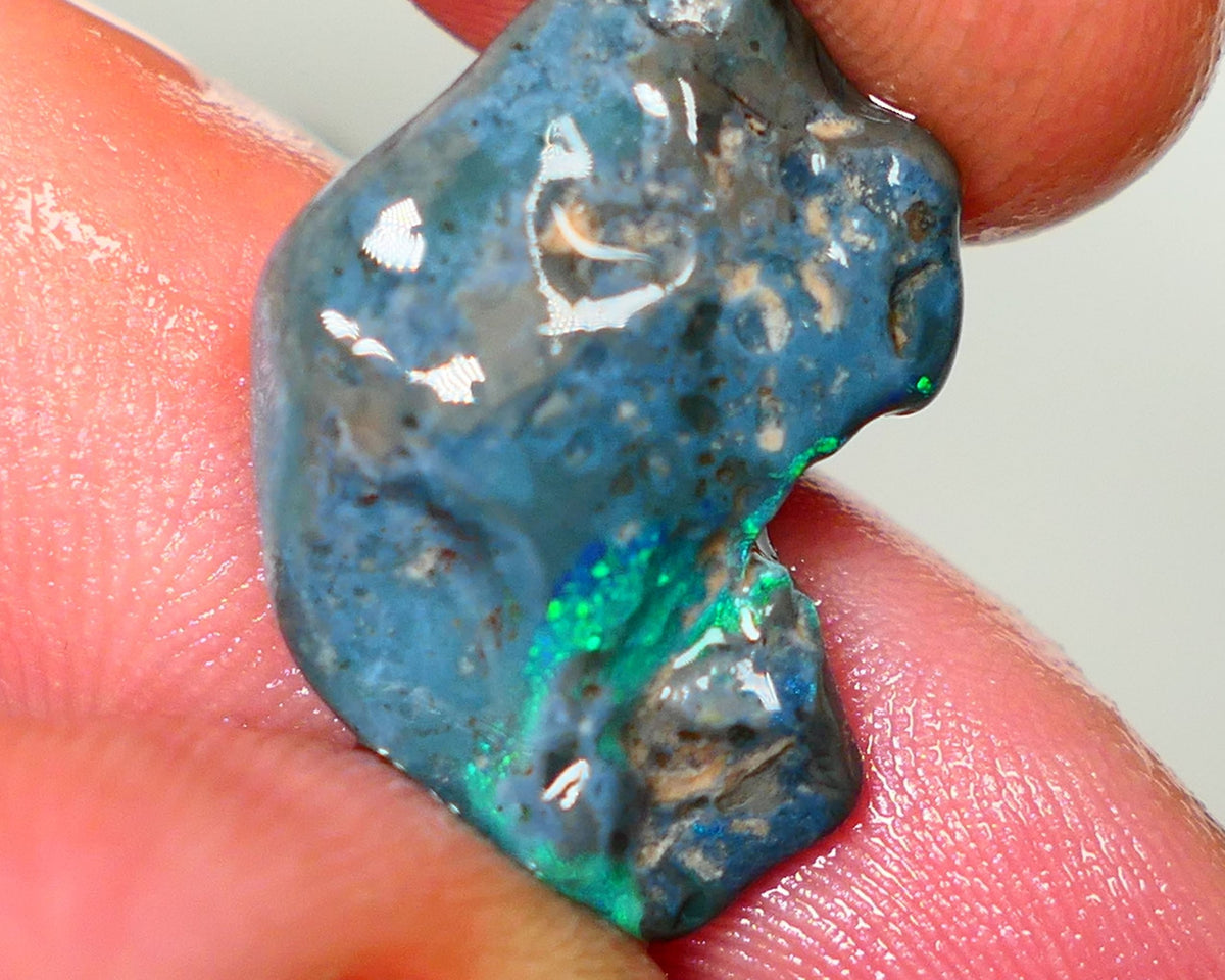 Lightning Ridge Rough Opal 14.00cts Dark Base rough with some pinfire flashes of bright Green/Blue Bar 24x17x7mm NS348