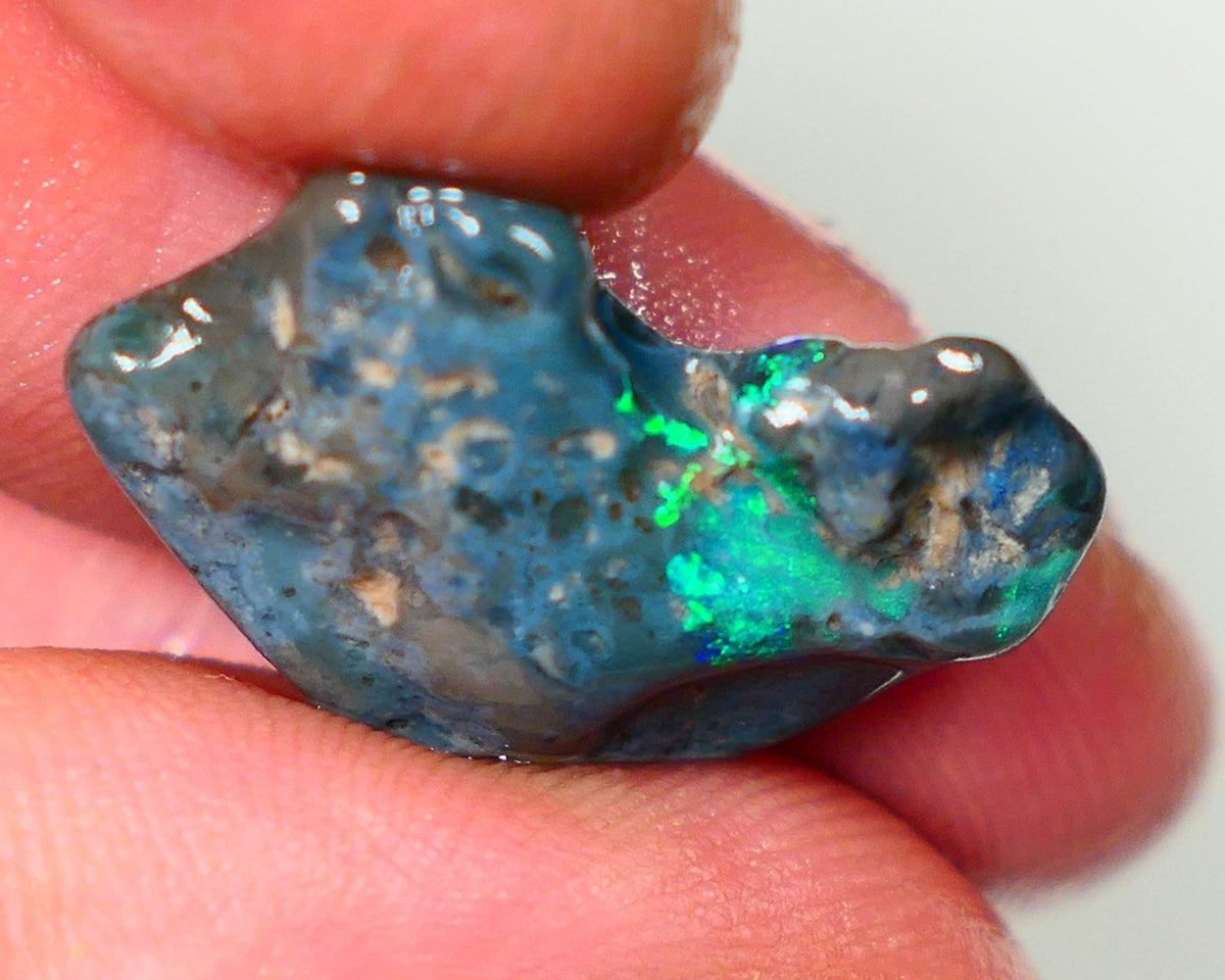 Lightning Ridge Rough Opal 14.00cts Dark Base rough with some pinfire flashes of bright Green/Blue Bar 24x17x7mm NS348