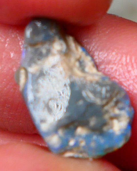 Lightning Ridge Rough Dark base knobby opal 4.50cts showing Greens & Blues in exposed side of bar with blue showing through the skin gamble to cut 16x10x5mm Auction90