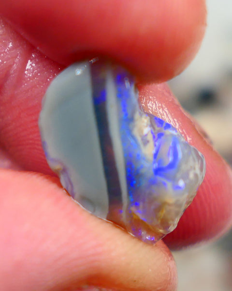 Lightning Ridge Rough Opal 6.00cts Crystal opal carrying fire sat on a bar with blues sat on dark base mother nature hey? Sold as gamble 17x10x7mm Auciton168